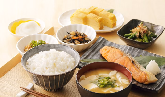 Balanced Japanese breakfast alongside a morning tonic