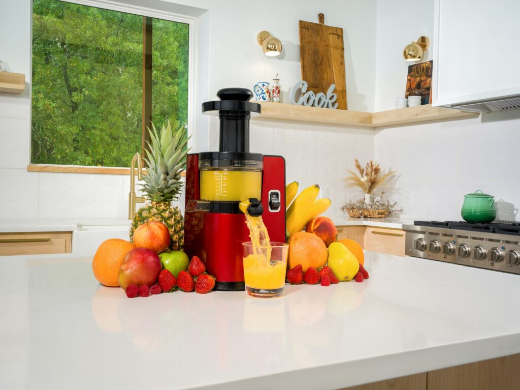 Colorful assortment of fresh fruits, leafy greens, and a blender ready to make Healthy Smoothie Recipes