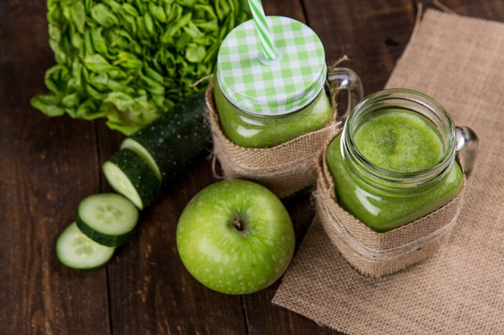 Healthy Smoothie Recipes on a desk, representing answers to common questions about smoothie preparation.