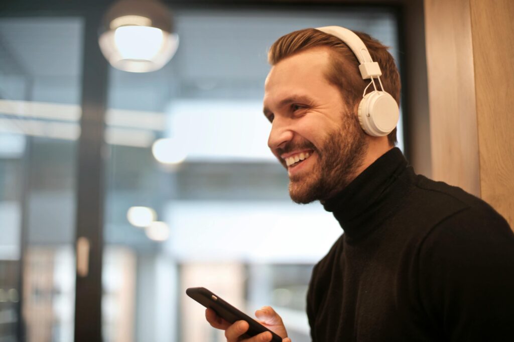 Listening manifestation audio program to motivational audios to reinforce manifestation techniques